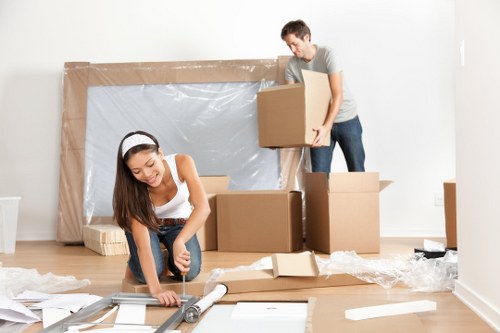 Moving boxes and furniture during a Man With Van Chiswick service