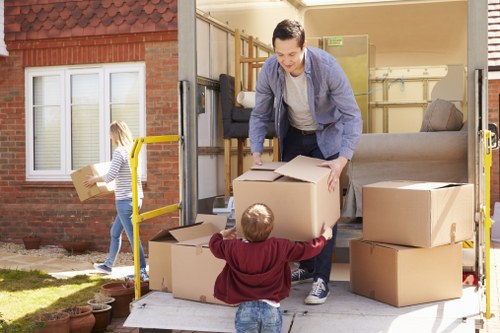 Van and helper loading items in a Chiswick residential street