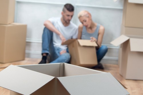 Professional office removals team handling furniture in West London