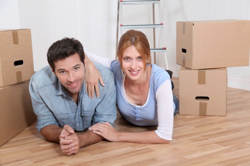 Packed moving boxes and furniture ready for transport in West London
