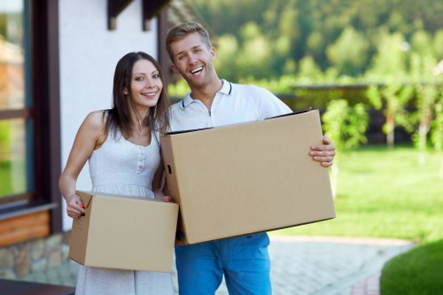 Removal van loading household items near Chiswick properties