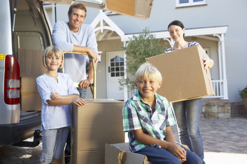 Movers carrying furniture from a flat in Chiswick